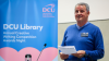 A man speaks from a lectern