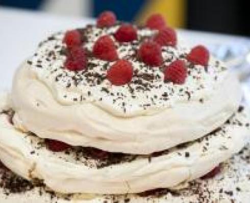 Shows Debbie's Raspberry and Chocolate Meringue Tower during DCU's Bake Off for Barretstown