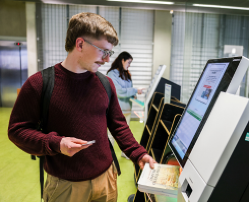 student using self issue machine