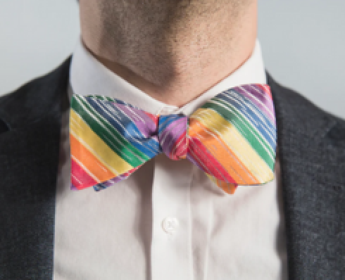 Man wearing a rainbow bowtie