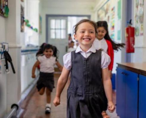 School child walking in a school corridor