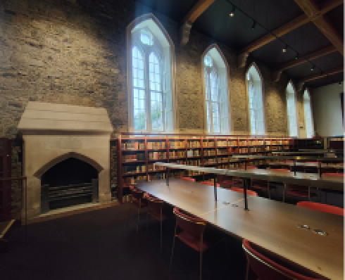 Interior of Woodlock showing study desk and fireplace