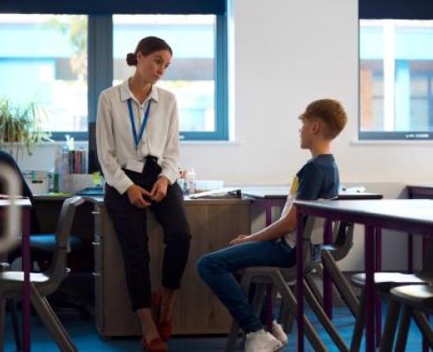 Teacher talking to a student