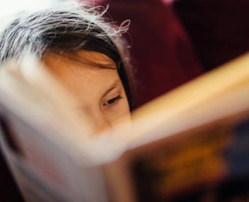 Student reading a book - Photo by Johnny McClung on Unsplash