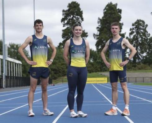 Athletics athletes posing on track