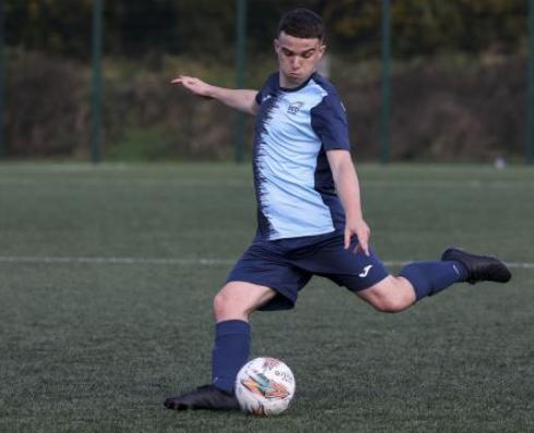 Soccer player kicking the ball