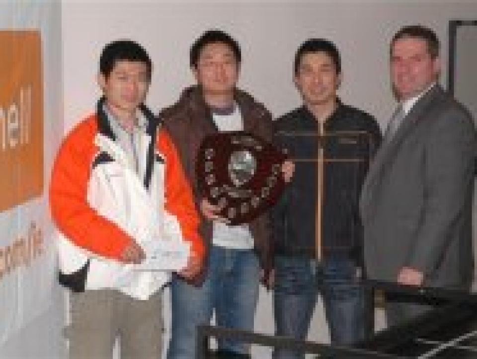 Dian Zhang, Xiang Ye, and Keyang Dai receiving their prize from sponsor Mr. Pat Devlin, of Farnell Ireland.