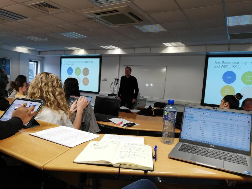 Lecturer teaching students in a classroom