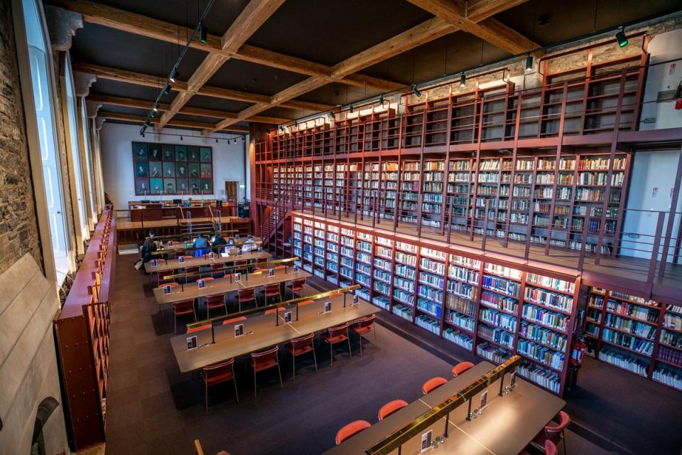 Interior of woodlock hall, with study desks and help desk