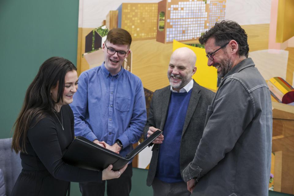 Four colleagues having a conversation