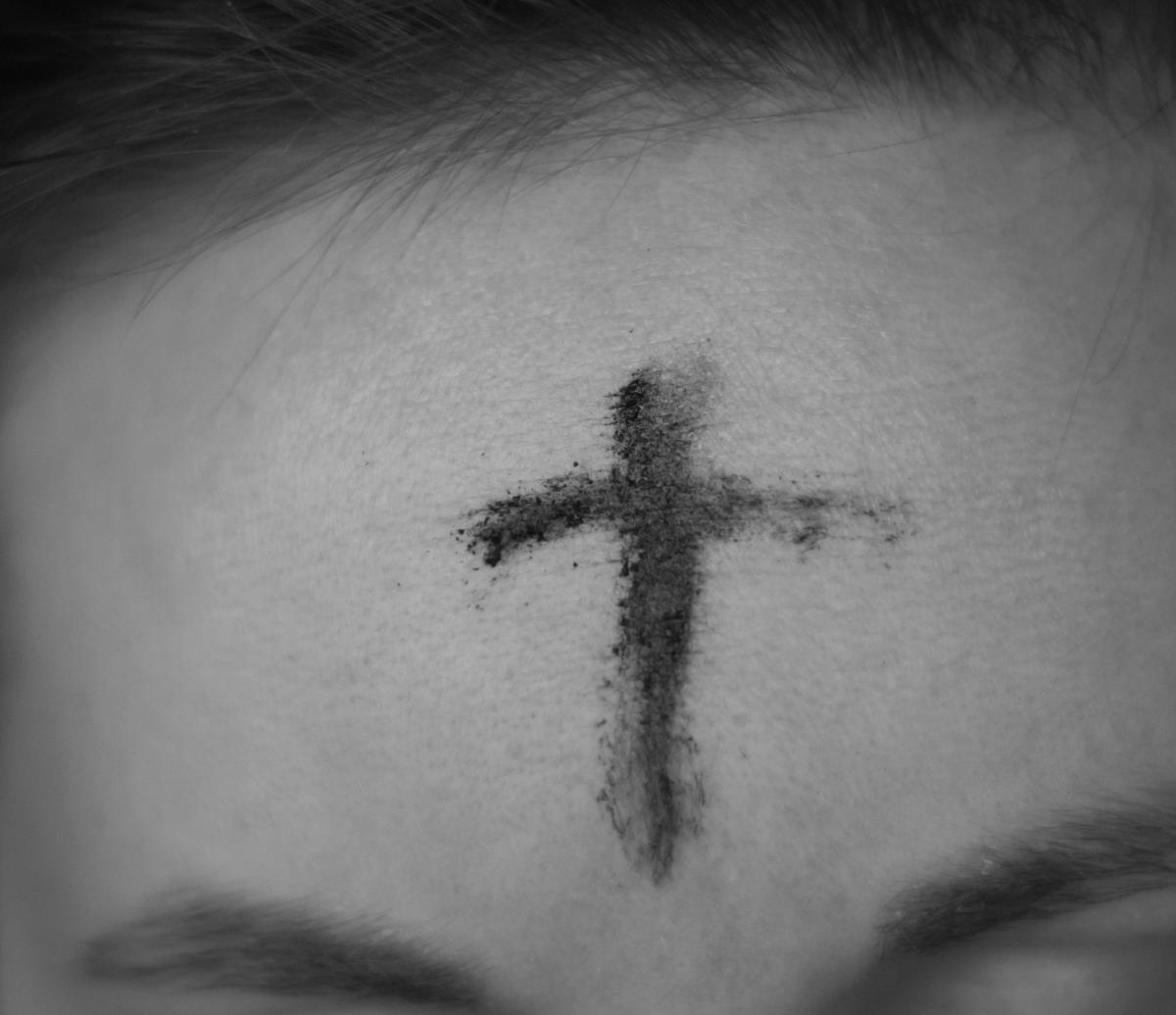 Cross of Ashes on congregant's forehead