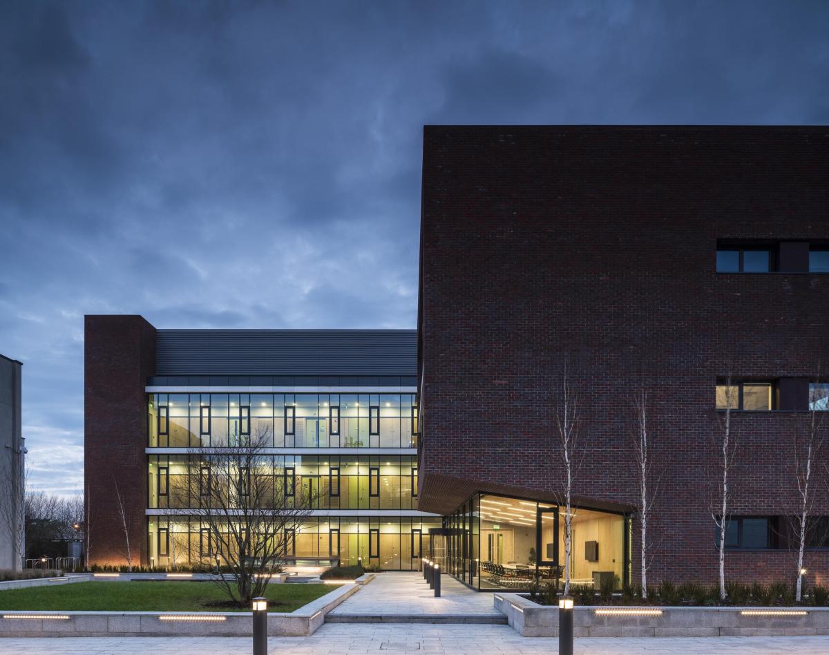 The NRF building at night with internal lights on