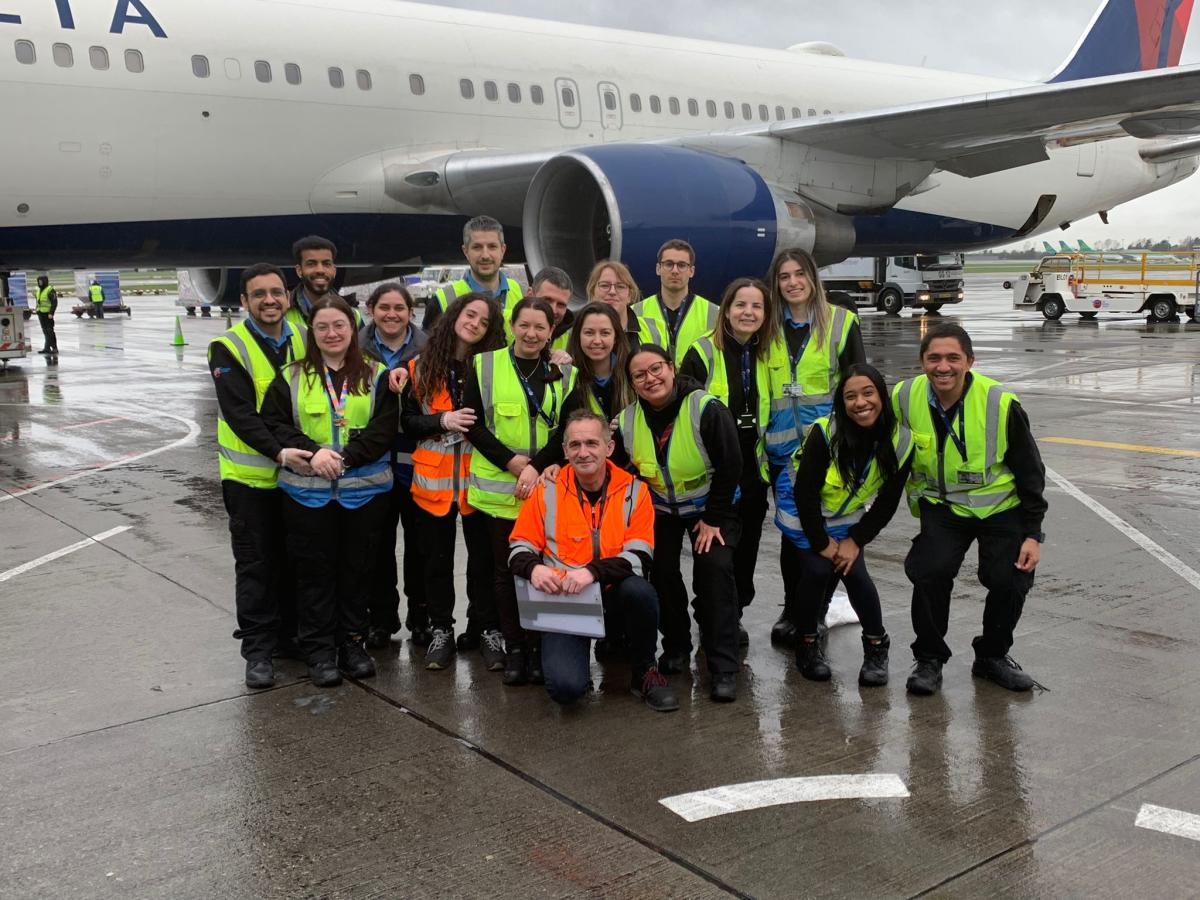 Sky Handling Partner - Group Photo of employees beside a plane