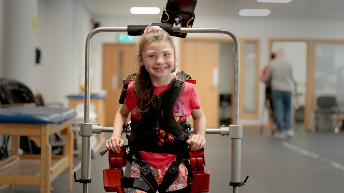 Picture of young girl in the paediatric exoskeleton