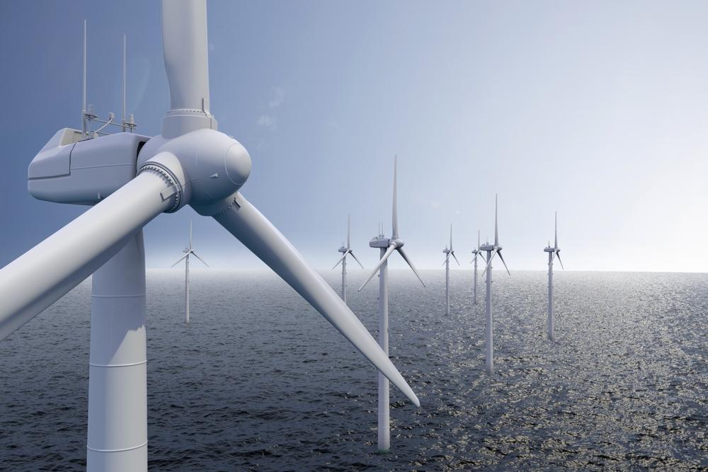 The image shows many wind turbines