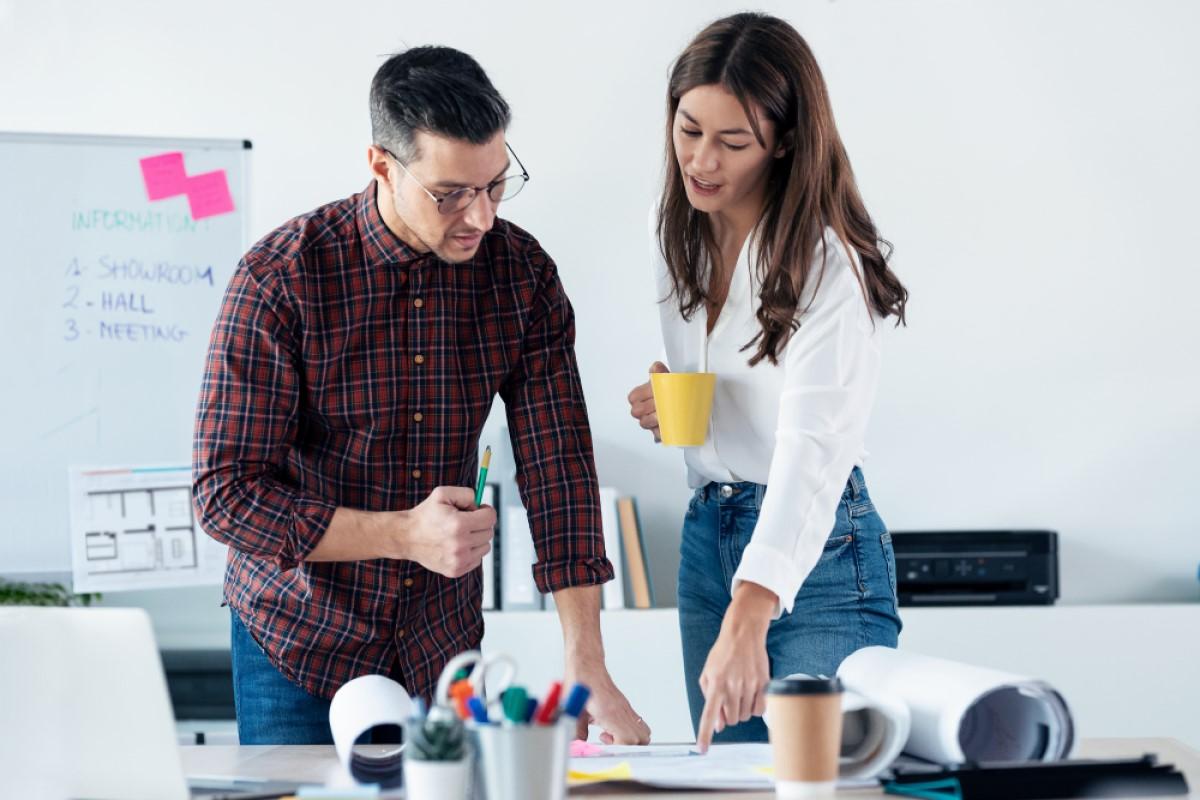 Woman giving feedback to man