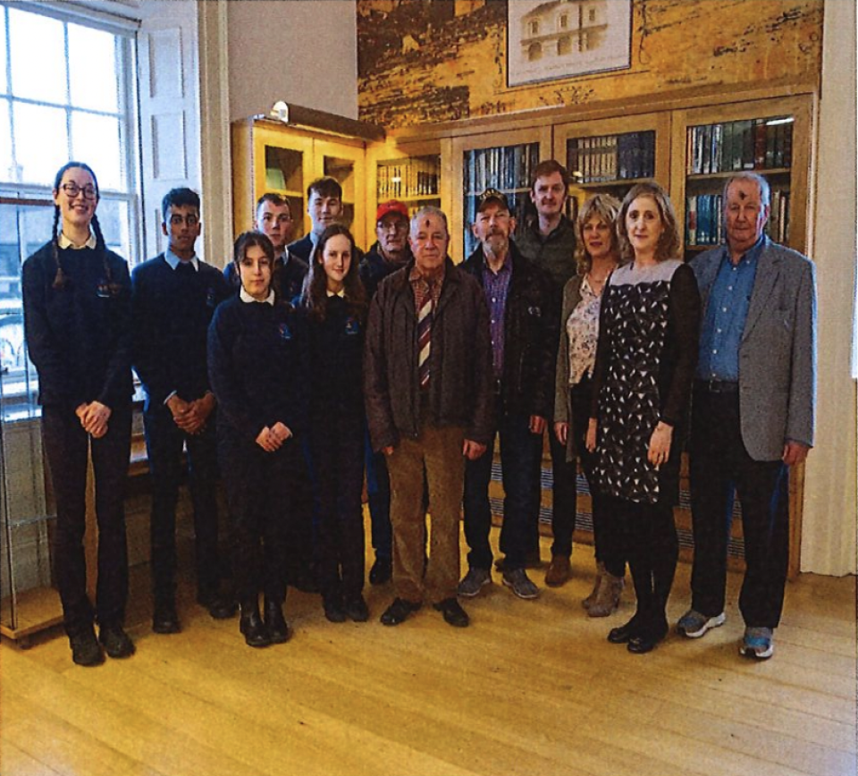 group of students and older people posing for camera