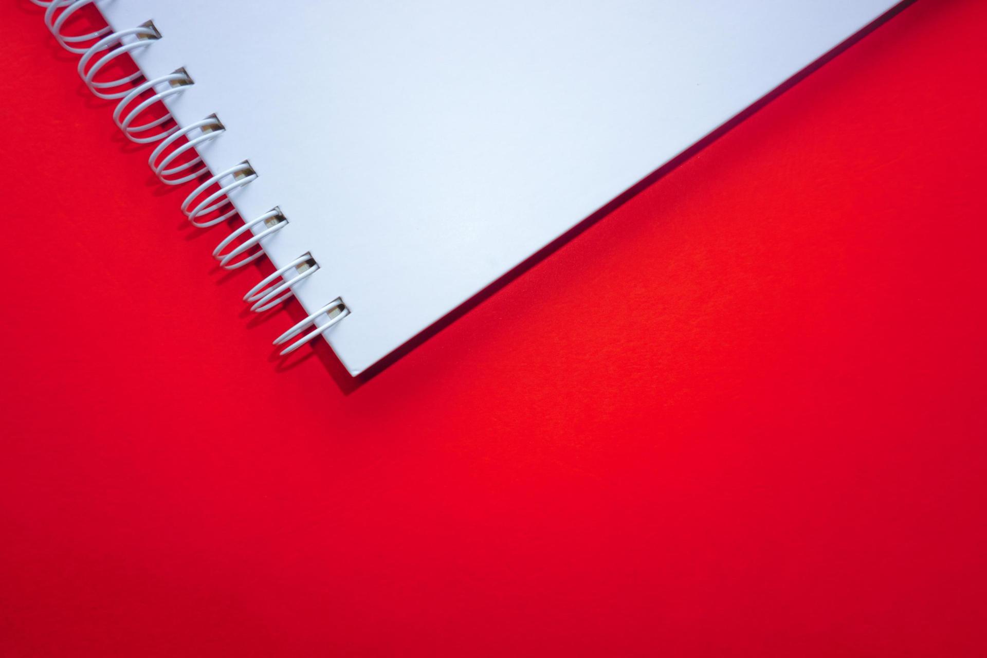 A notebook against a red background