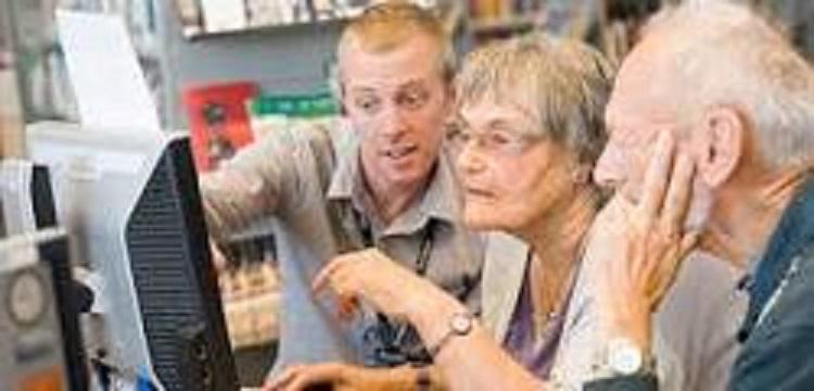 Older people looking at computer screen