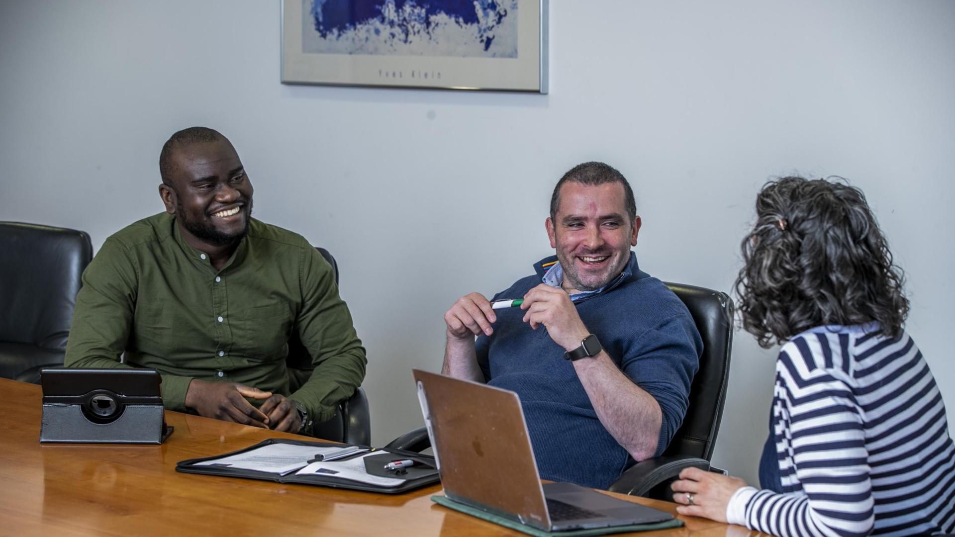 Three DCU colleagues in conversation