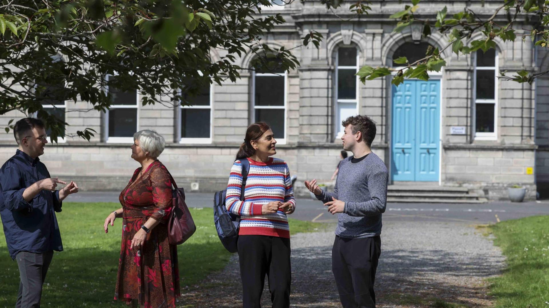 Colleagues chatting outside St Pats