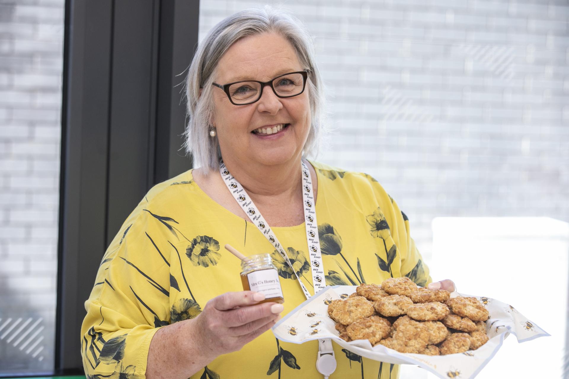 Shows Carol Grehan with her honey biscuits during the DCU Bake Off for Barretstown