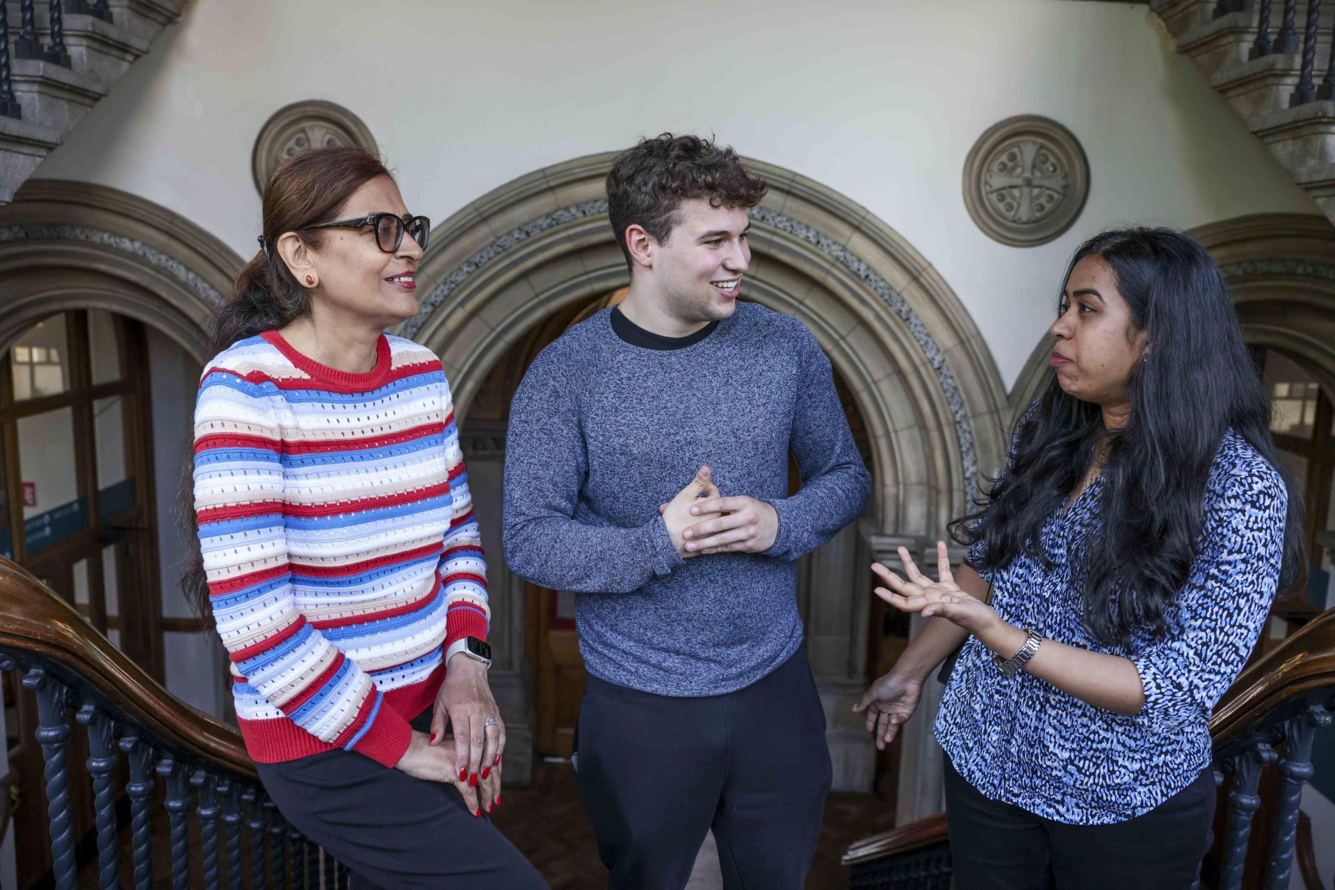 Three DCU colleagues in discussion on DCU All Hallows campus