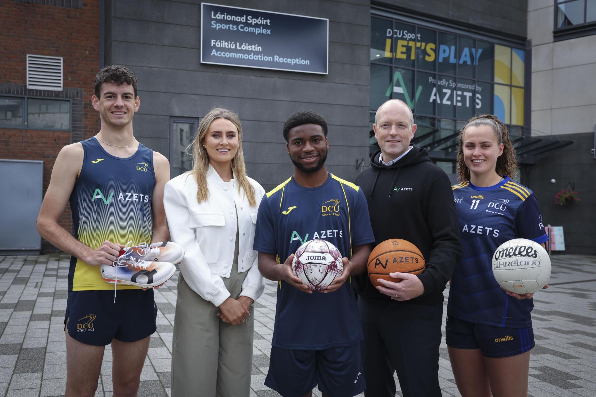 DCU Sport representatives and Azets CEO in front of the DCU Gym.