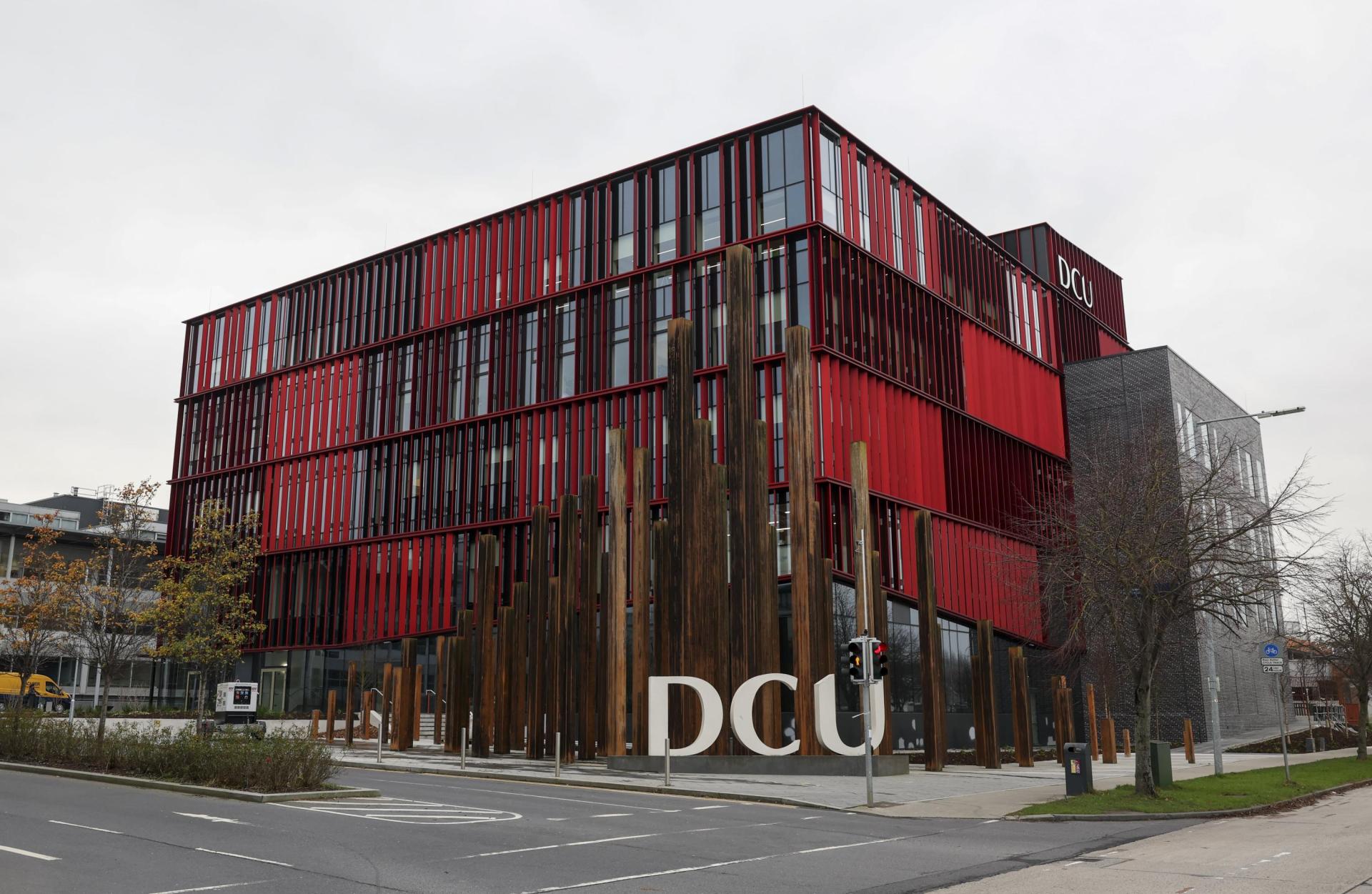 An exterior shot of the Polaris Building with DCU letters in front.